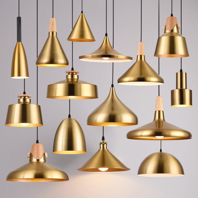 Brass pendant lighting family featuring multiple sizes and design variations.