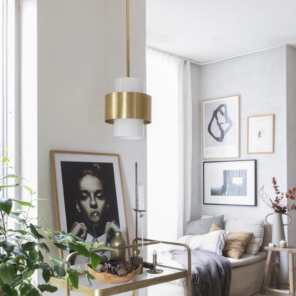 Brass pendant lighting installed in a luxury hospitality interior.
