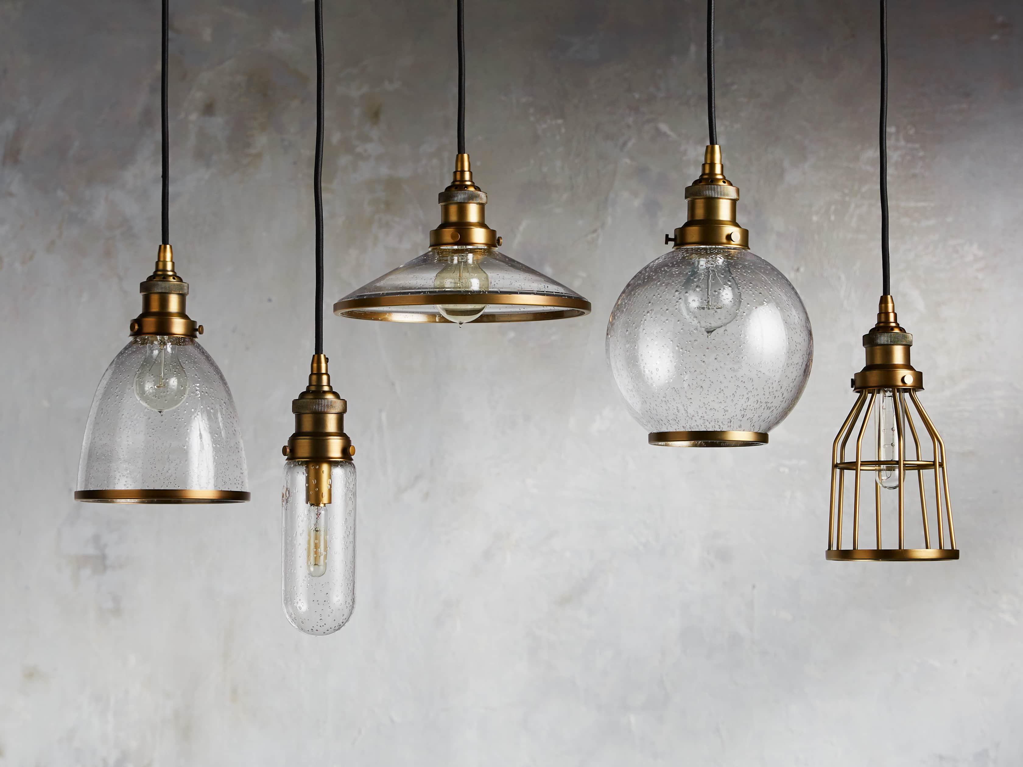 Brass pendant lighting family featuring multiple sizes and design variations.