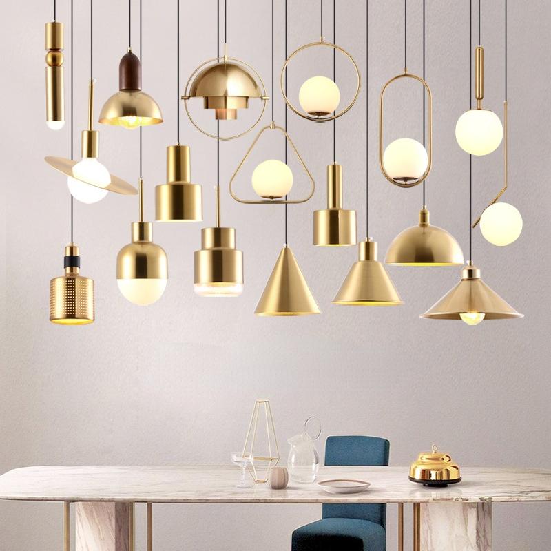 Brass pendant lighting family featuring multiple sizes and design variations.