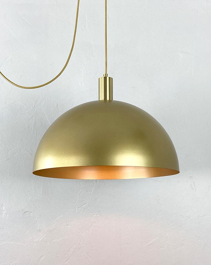 Front view of a premium brass pendant light for architectural interiors.