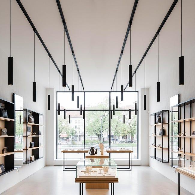 Pendant-mounted architectural spotlights installed in a hospitality and retail environment.