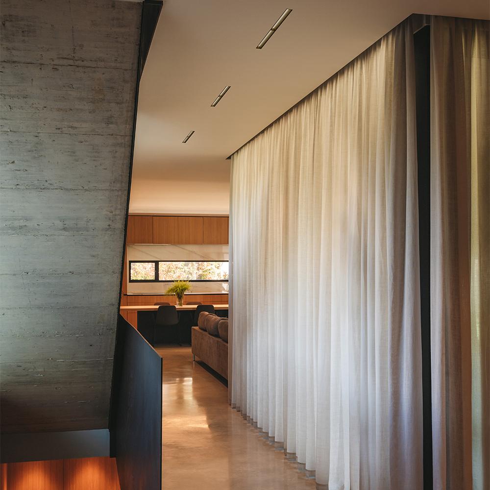 Trimless wall washer seamlessly integrated into a contemporary hospitality interior.