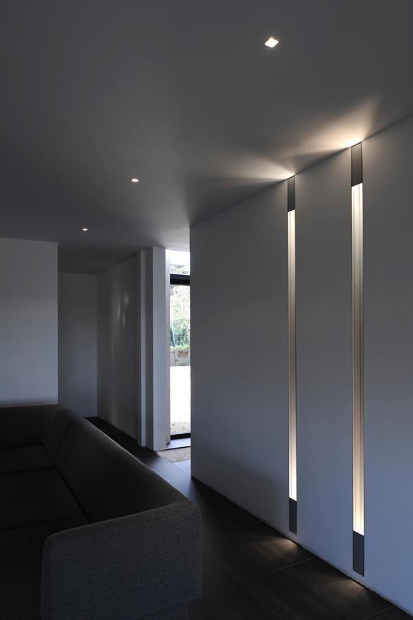 Trimless wall washer seamlessly integrated into a contemporary hospitality interior.