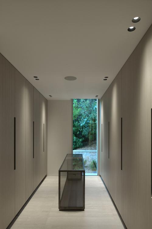 Trimless wall washer seamlessly integrated into a contemporary hospitality interior.