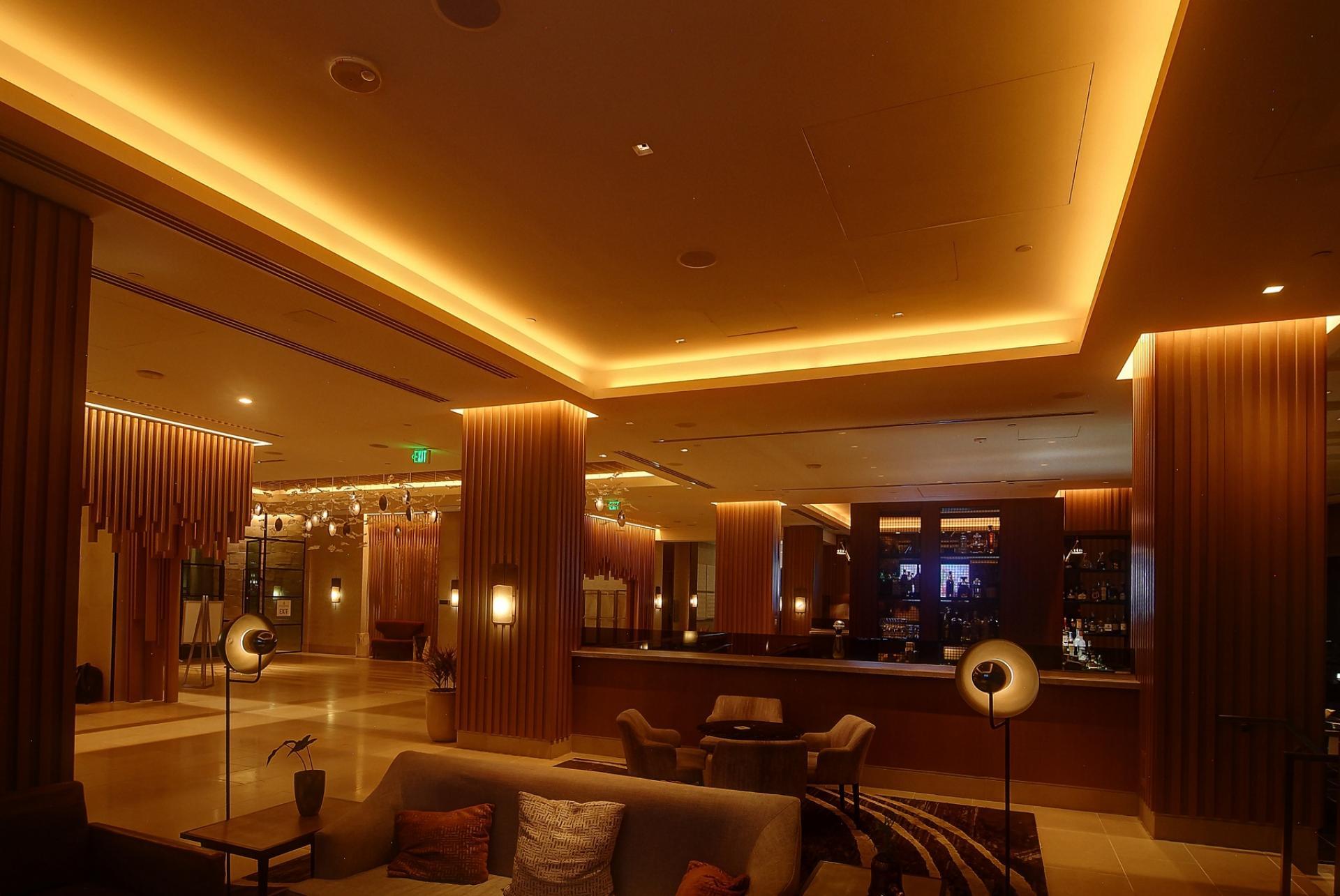 Cove lighting integrated into a contemporary hospitality interior.