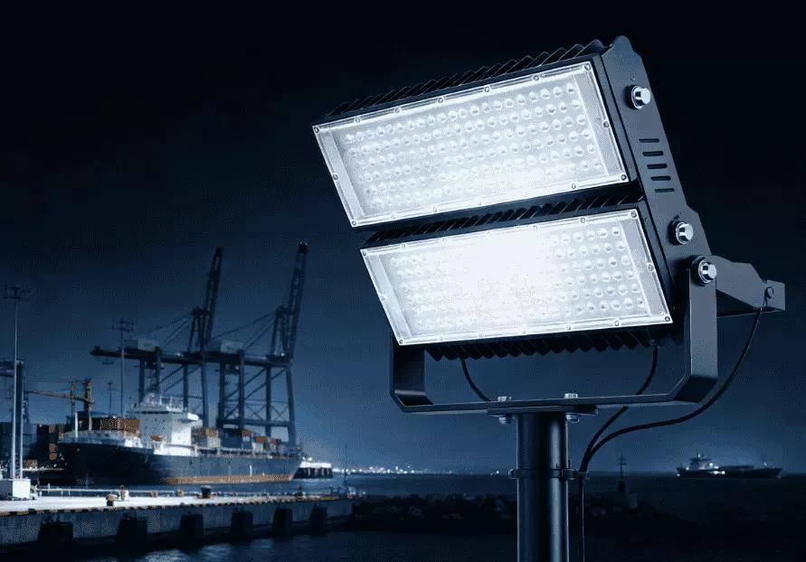 Long throw LED floodlights illuminating a large-scale infrastructure project.