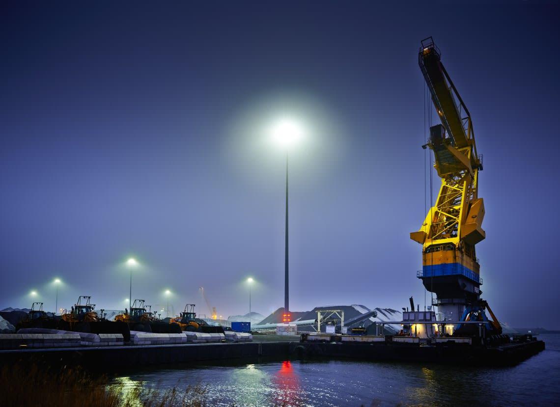 Long throw LED floodlights illuminating a large-scale infrastructure project.