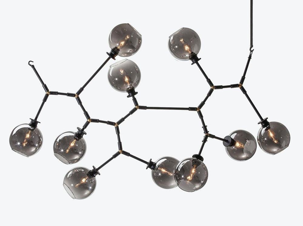Front view of a contemporary globe chandelier featuring opal glass spheres.