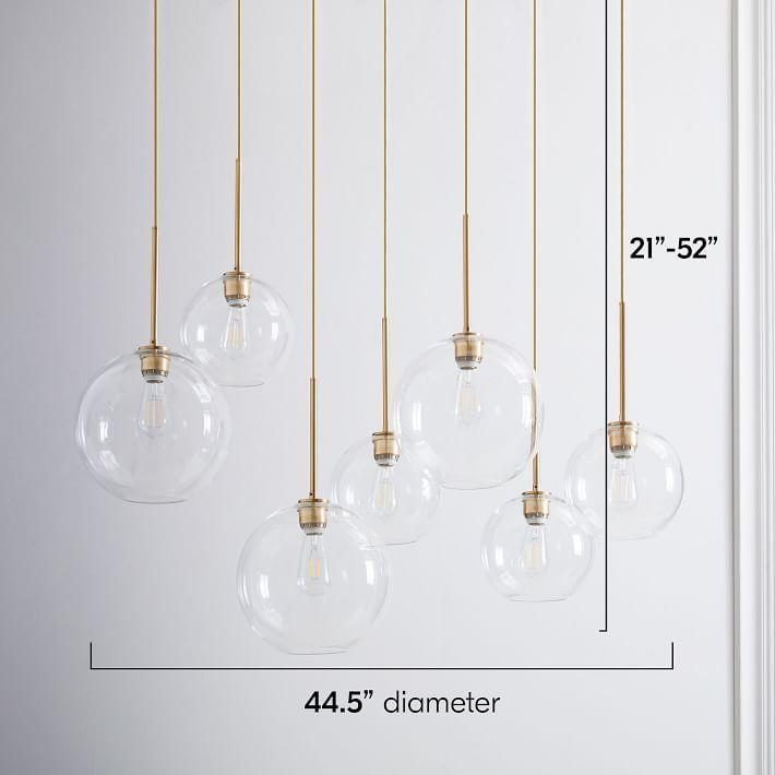 Globe chandelier family displaying linear, radial and molecular-inspired configurations.