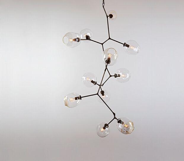 Front view of a contemporary globe chandelier featuring opal glass spheres.