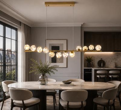 Globe chandelier installed in a premium residential dining area with contemporary architectural design.