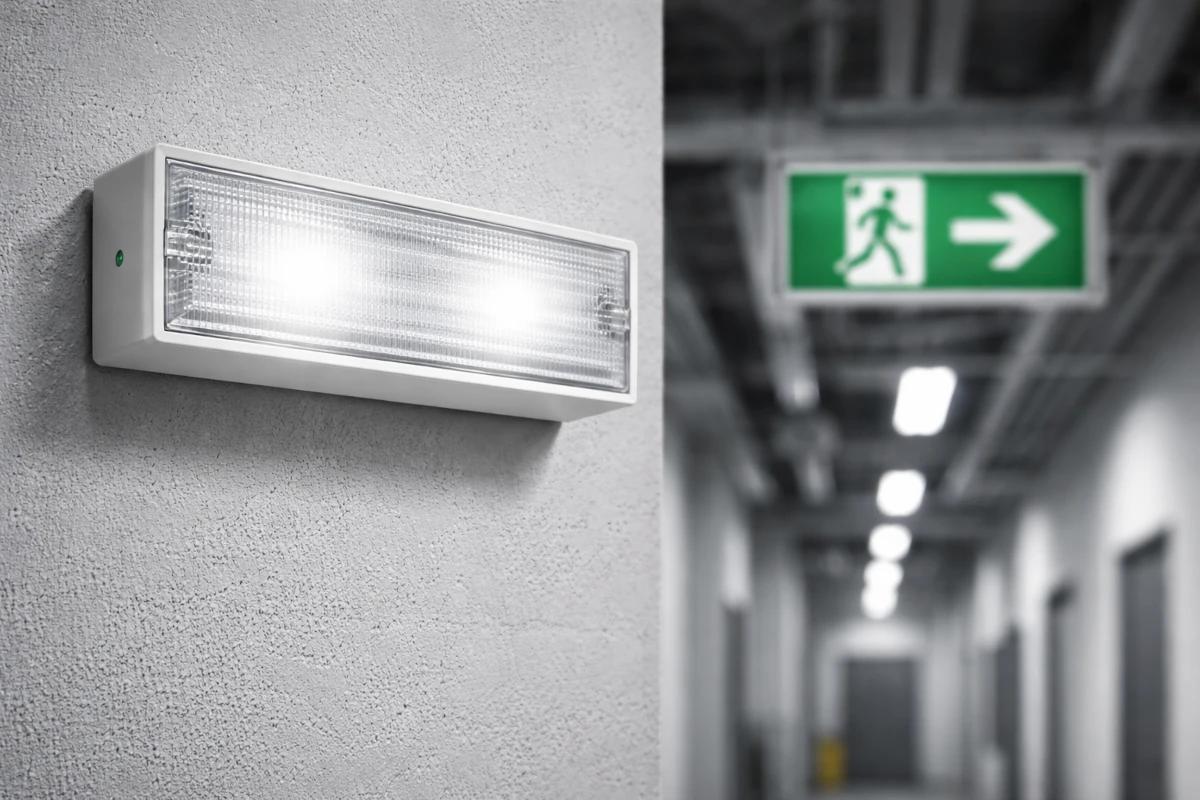 Emergency bulkhead lights installed in an industrial environment.
