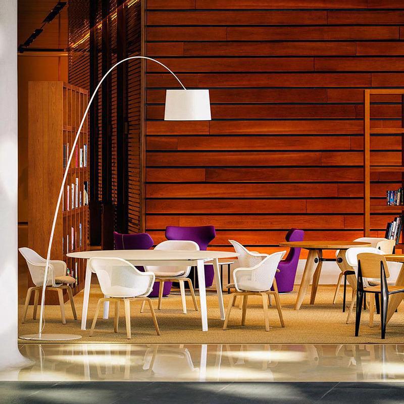 Arc floor lamp installed in a contemporary hospitality interior.