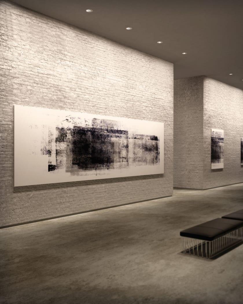 Asymmetric wall washer providing uniform vertical illumination in a contemporary museum gallery.