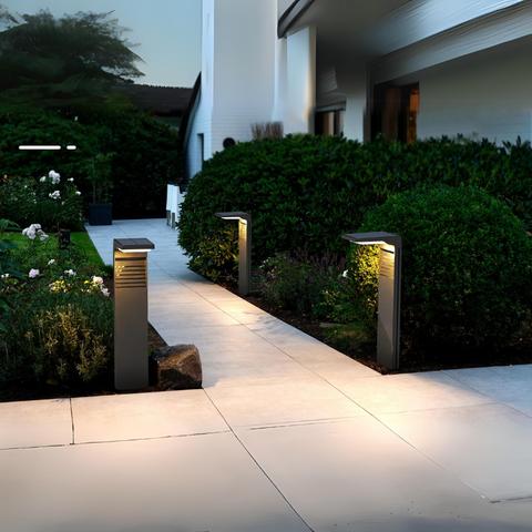 Solar bollards installed along a contemporary landscape pathway.