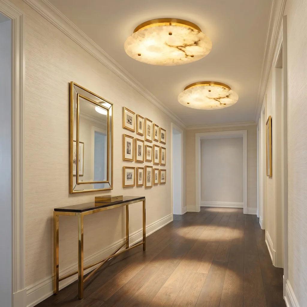 Marble ceiling lighting creating a refined decorative atmosphere in an elegant hospitality interior