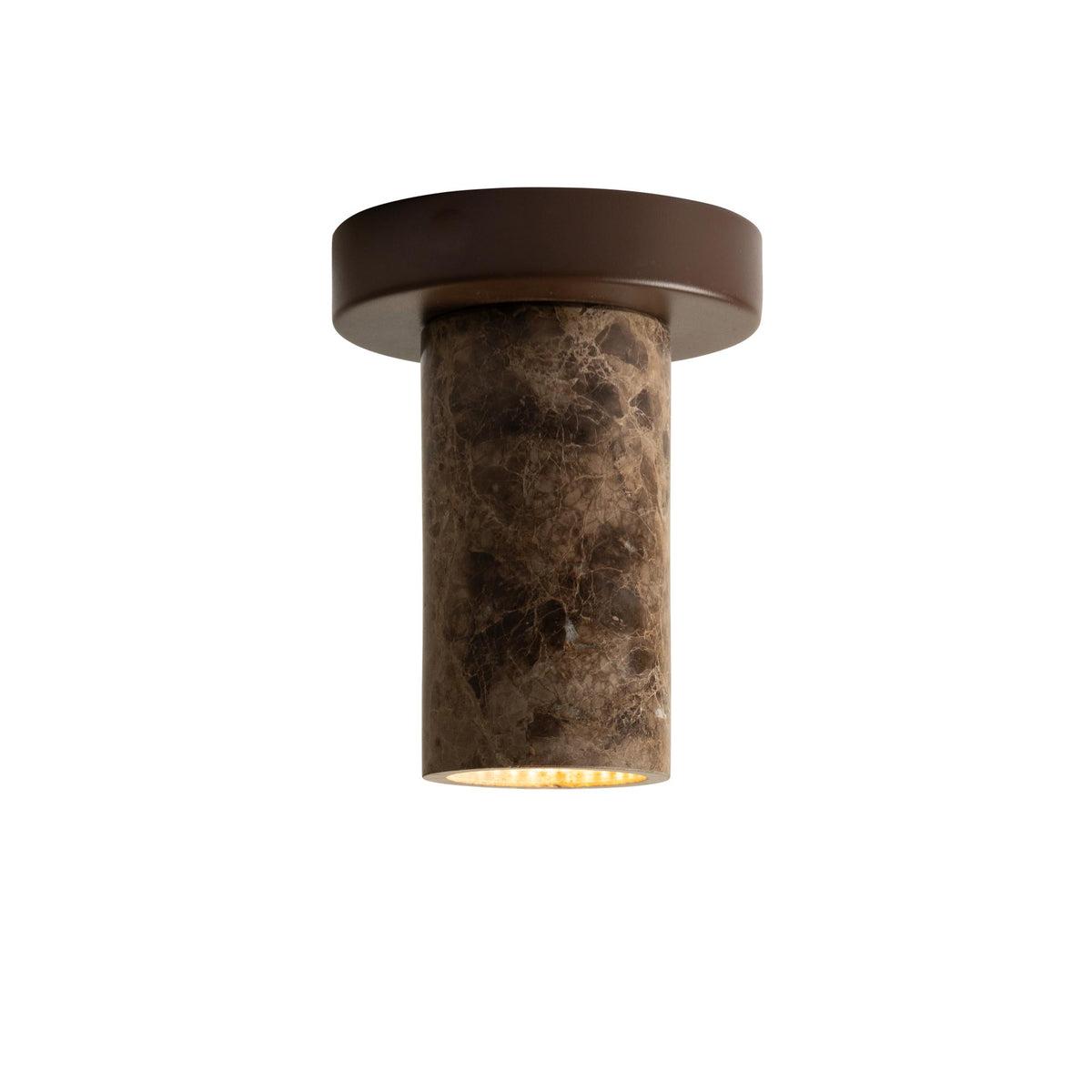 Contemporary ceiling light featuring a dark natural marble element on a white background