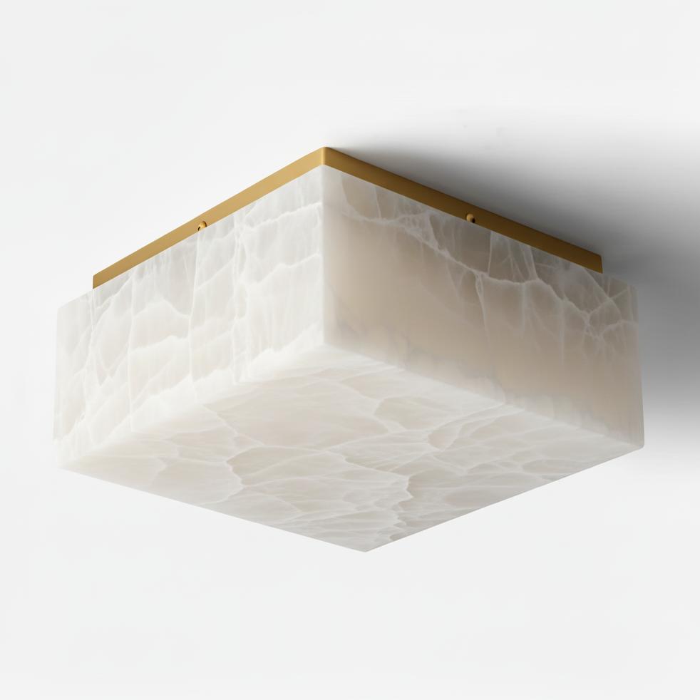 Geometric marble ceiling light with visible natural stone detailing shown from the front on a white background
