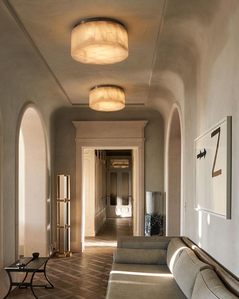 Marble ceiling lighting creating a refined decorative atmosphere in an elegant hospitality interior