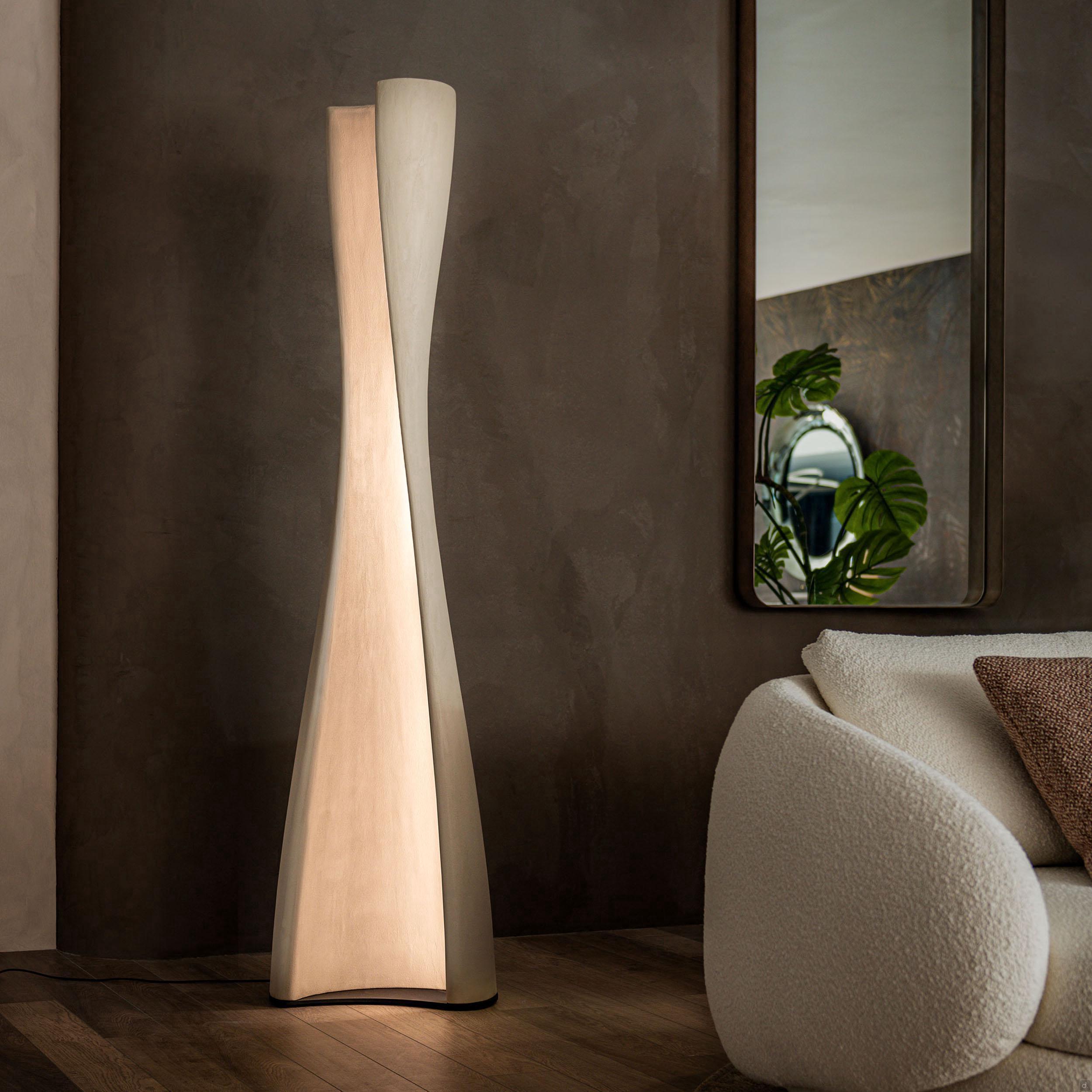 Sculptural floor lamp installed as a statement lighting feature in a contemporary hospitality interior.