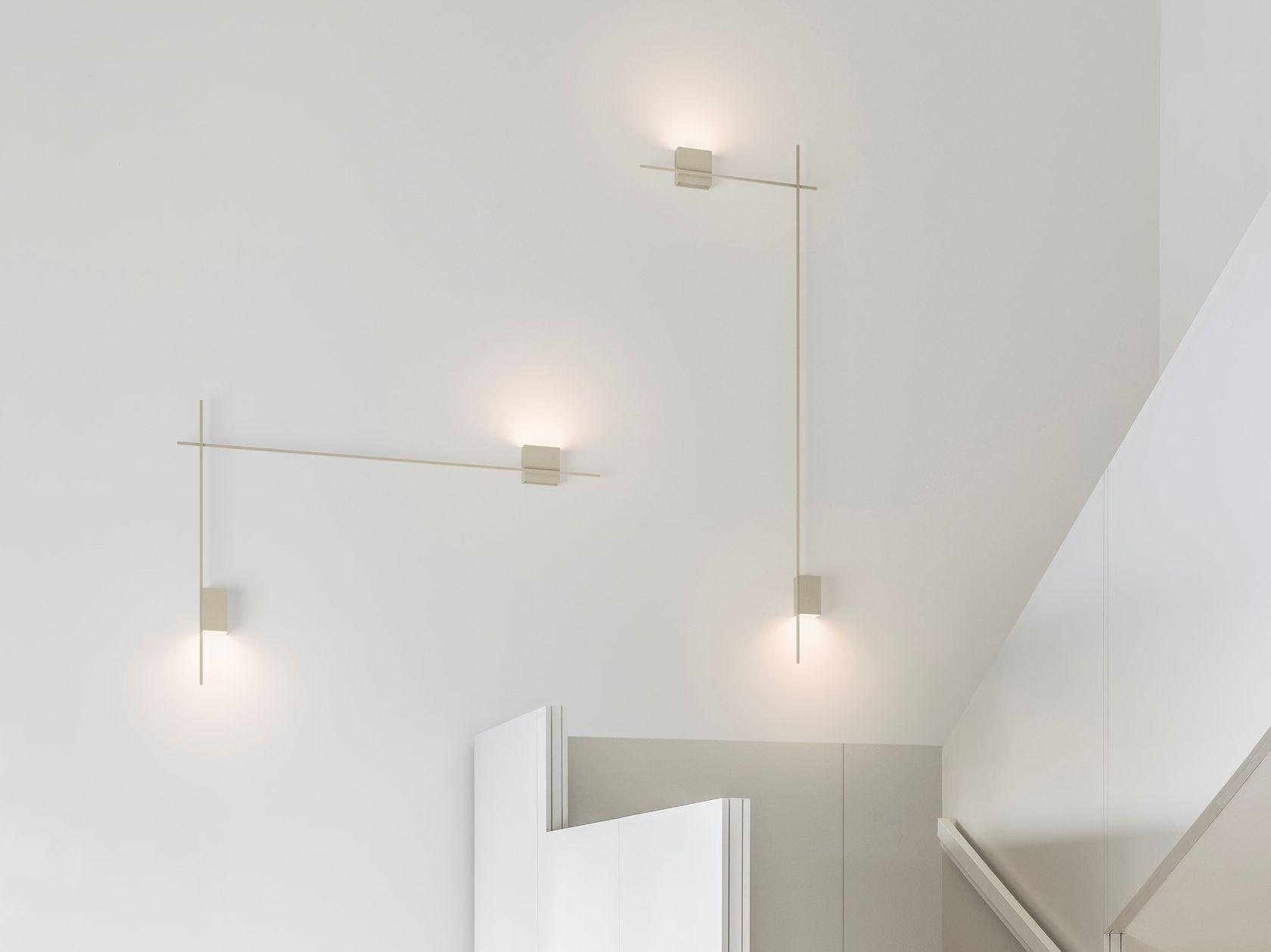 Minimal wall lamp installed in a contemporary hospitality interior.