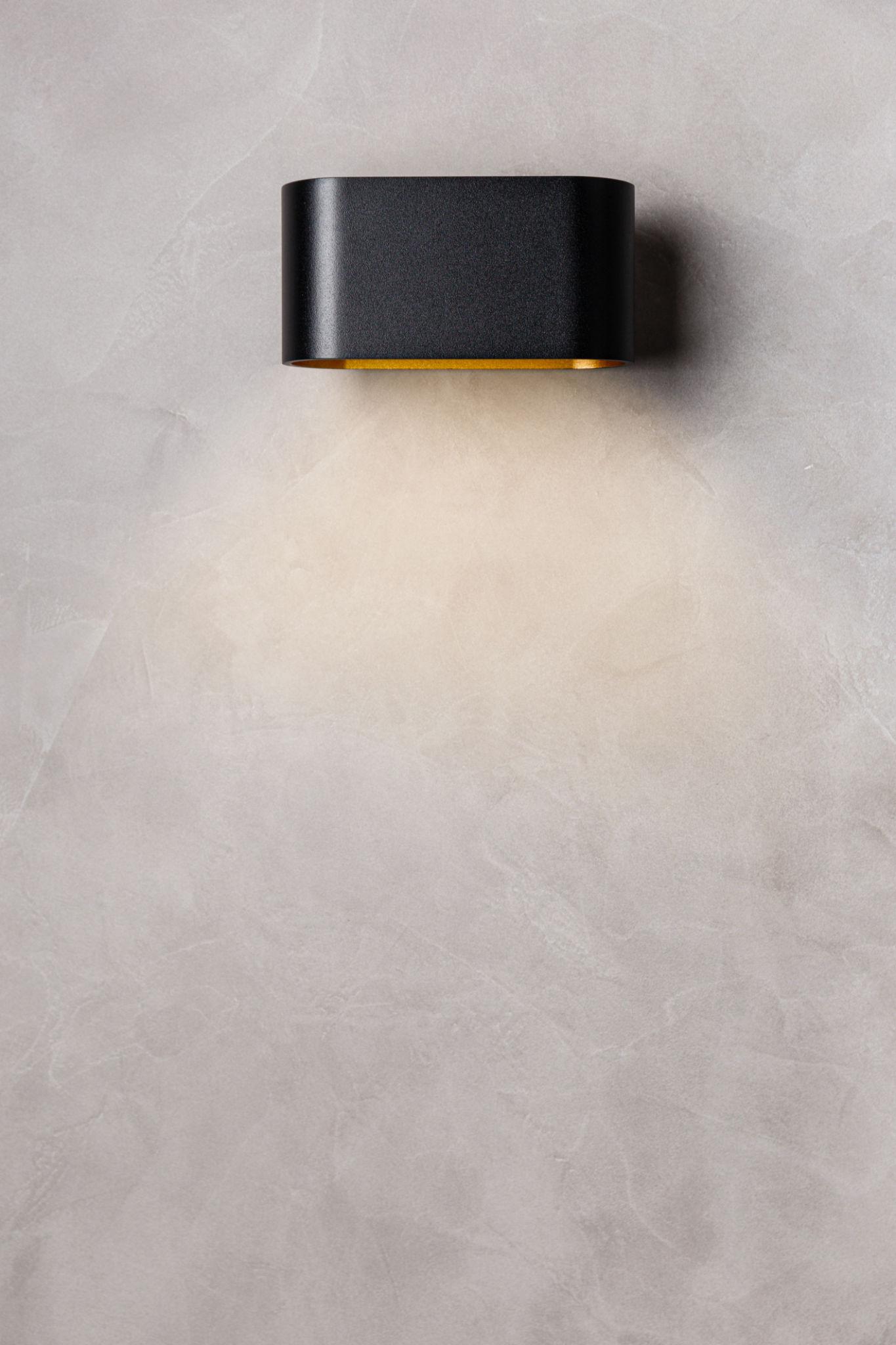 Front view of a minimalist architectural wall lamp.