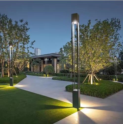 Decorative pole lights installed in a contemporary hospitality landscape.
