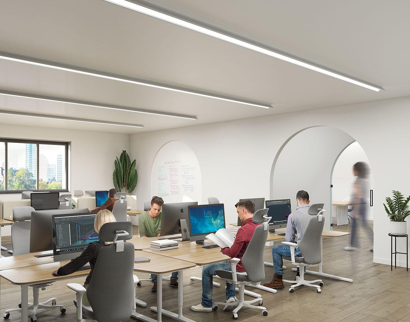 Surface-mounted linear lights installed in a contemporary office environment.