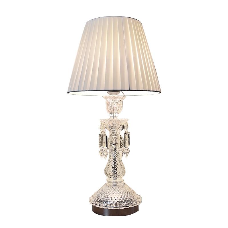 Crystal table lamp photographed on a clean white background showcasing precision-cut crystal elements and premium metal finishes.