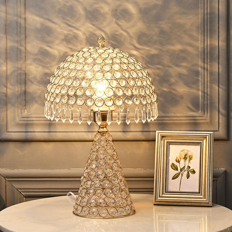 Crystal table lamp displayed in a luxury hotel lobby creating sparkling reflections and sophisticated ambient lighting.