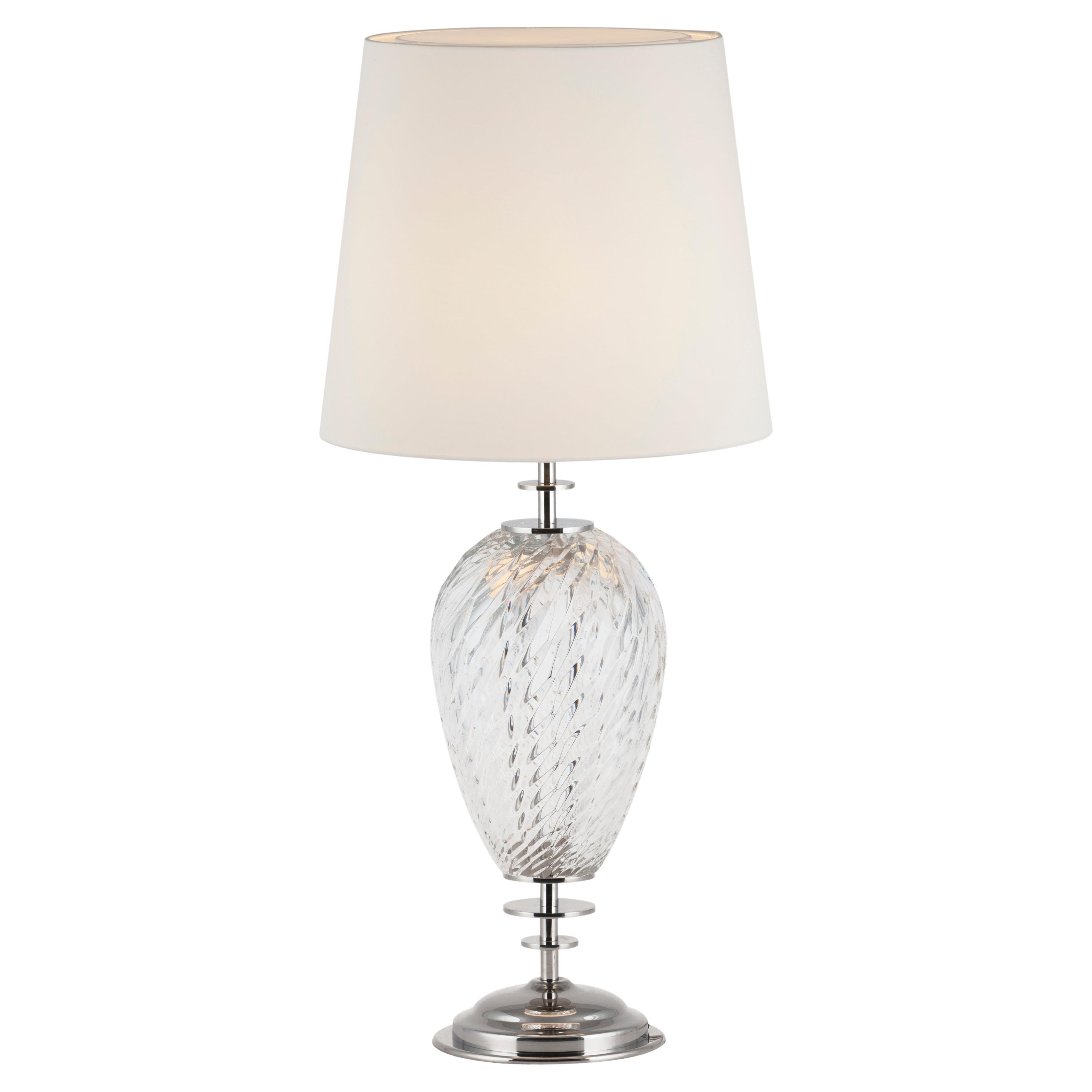 Crystal table lamp photographed on a clean white background showcasing precision-cut crystal elements and premium metal finishes.