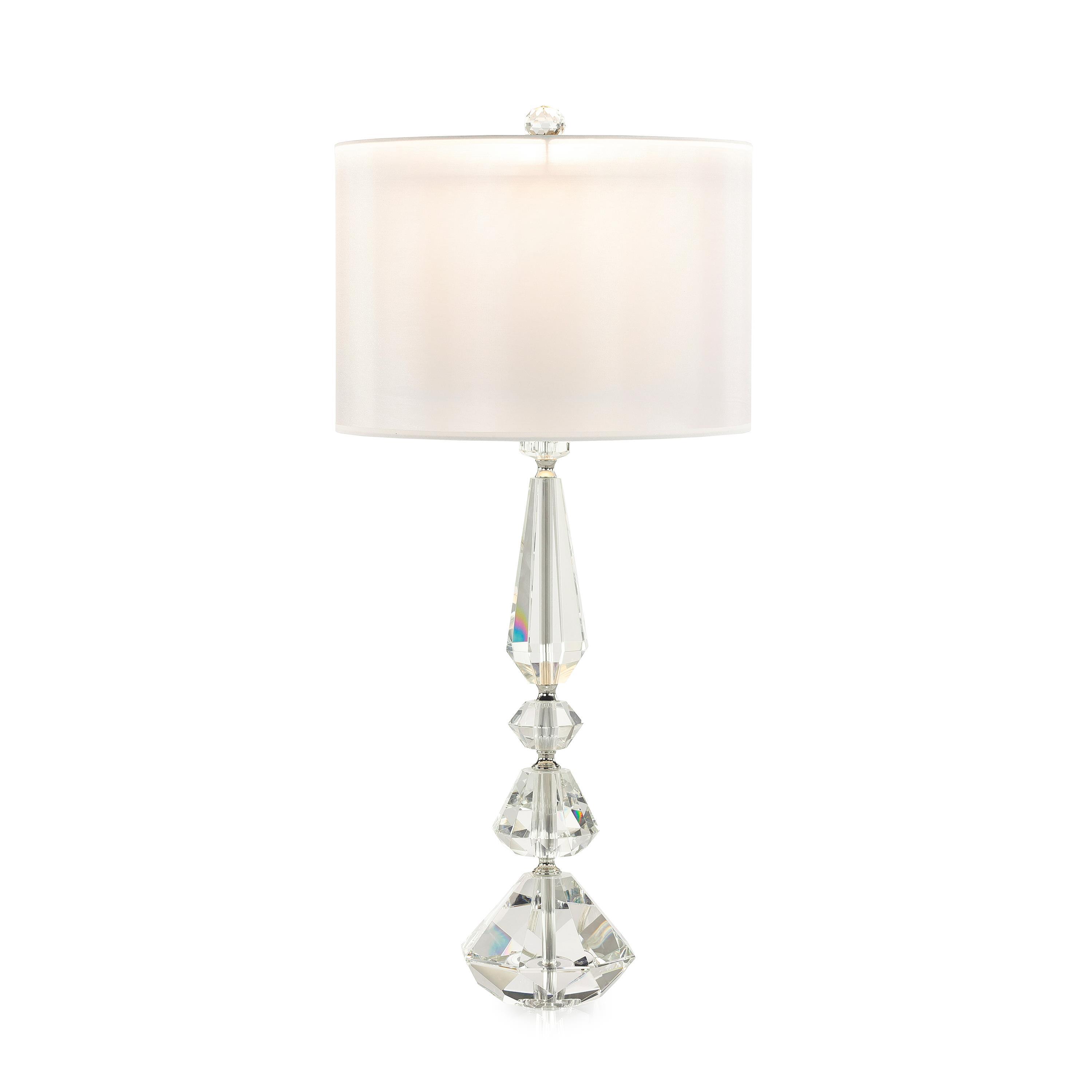 Crystal table lamp photographed on a clean white background showcasing precision-cut crystal elements and premium metal finishes.