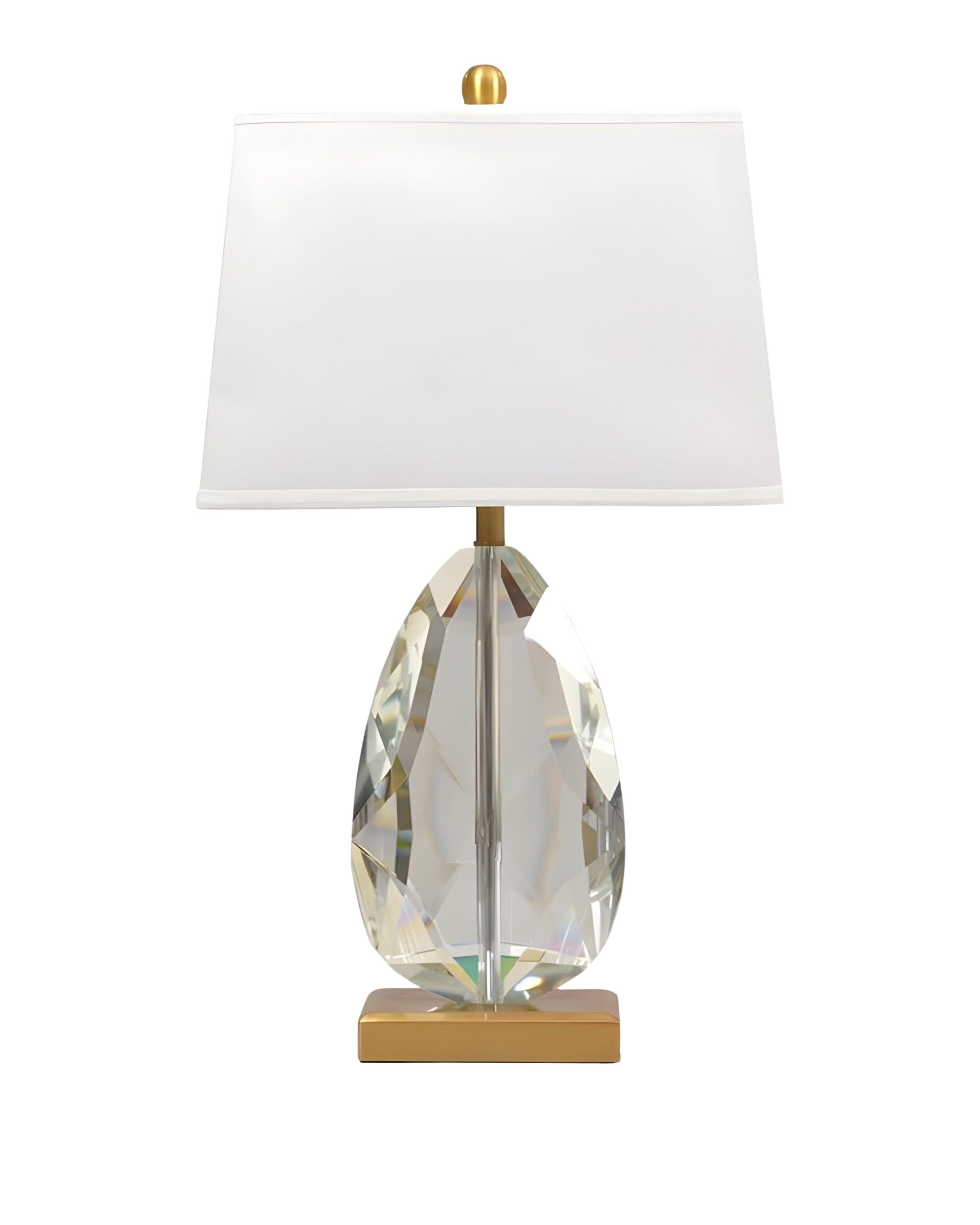Crystal table lamp photographed on a clean white background showcasing precision-cut crystal elements and premium metal finishes.