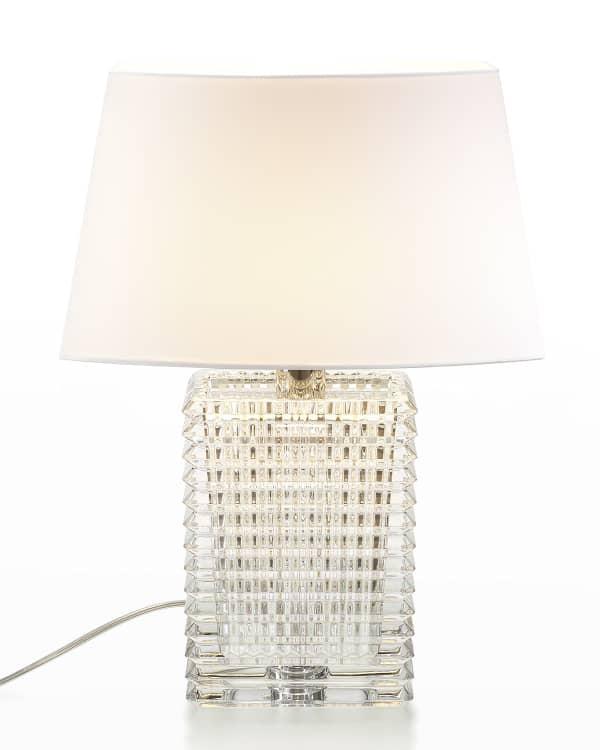 Crystal table lamp photographed on a clean white background showcasing precision-cut crystal elements and premium metal finishes.