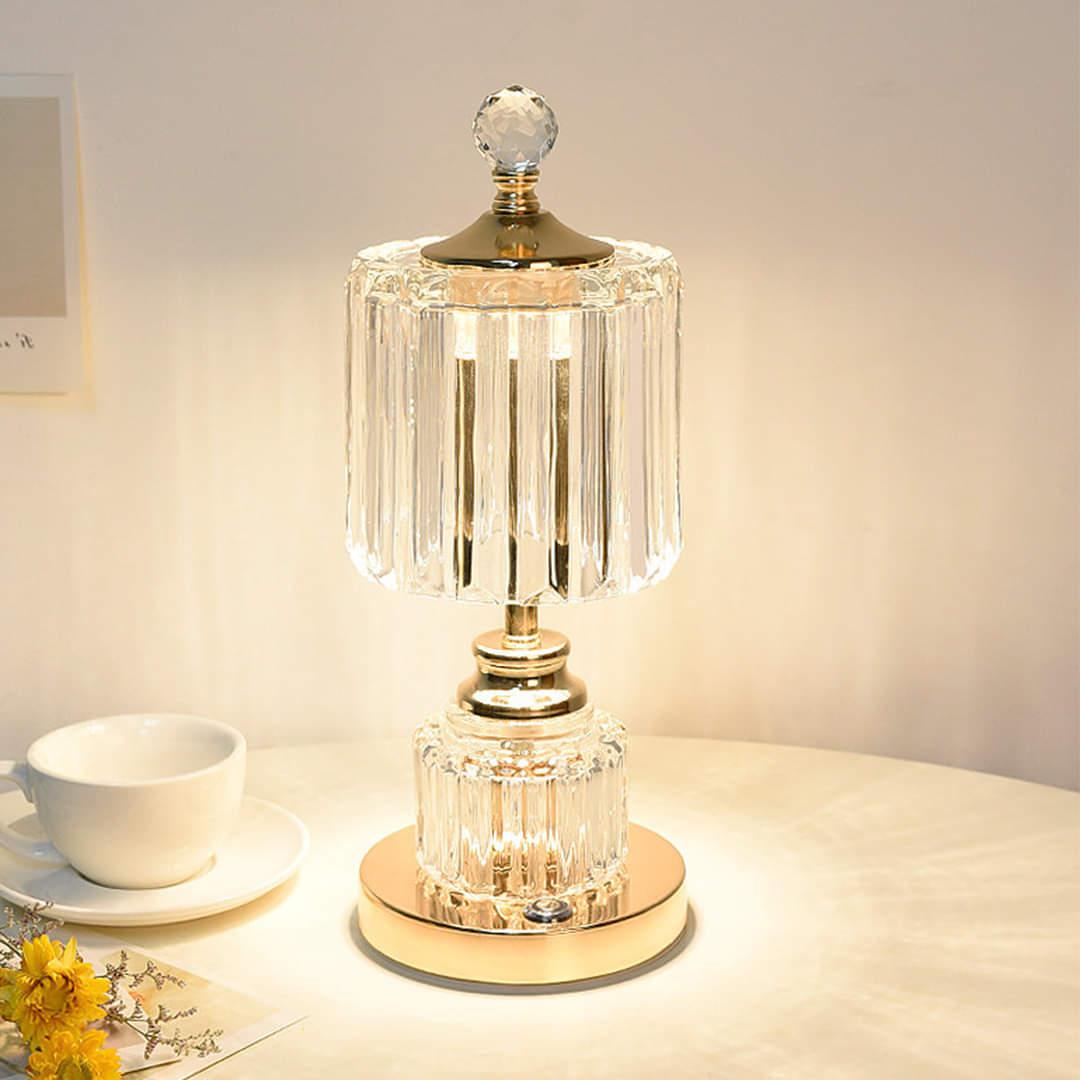 Crystal table lamp displayed in a luxury hotel lobby creating sparkling reflections and sophisticated ambient lighting.