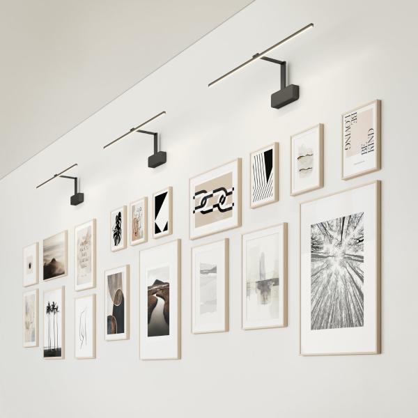 Picture wall lamp illuminating artwork inside a luxury gallery and hospitality interior.