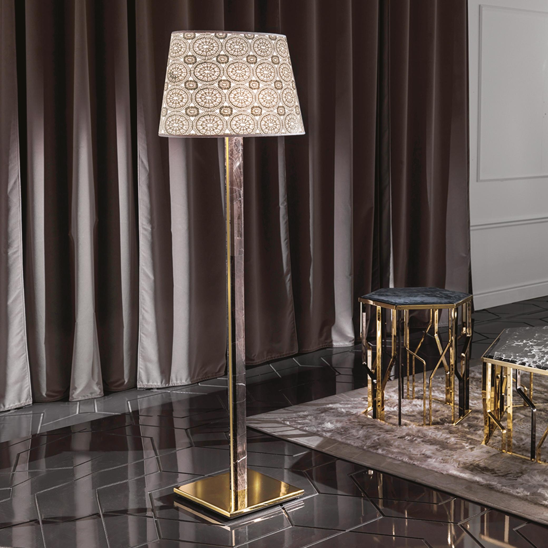 Luxury floor lamp positioned in a five-star hotel lobby creating warm ambient lighting and an elegant architectural focal point.