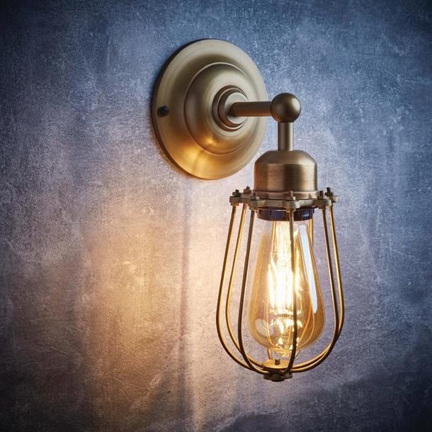 Front view of a contemporary cage wall lamp featuring geometric open-frame construction.