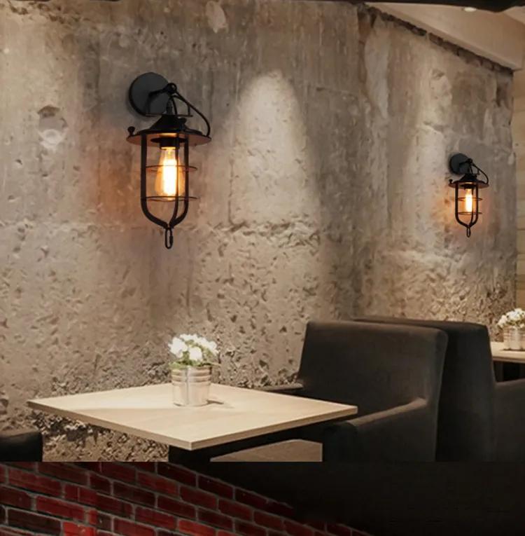 Cage wall lamp installed in a contemporary hospitality interior with industrial architectural styling.