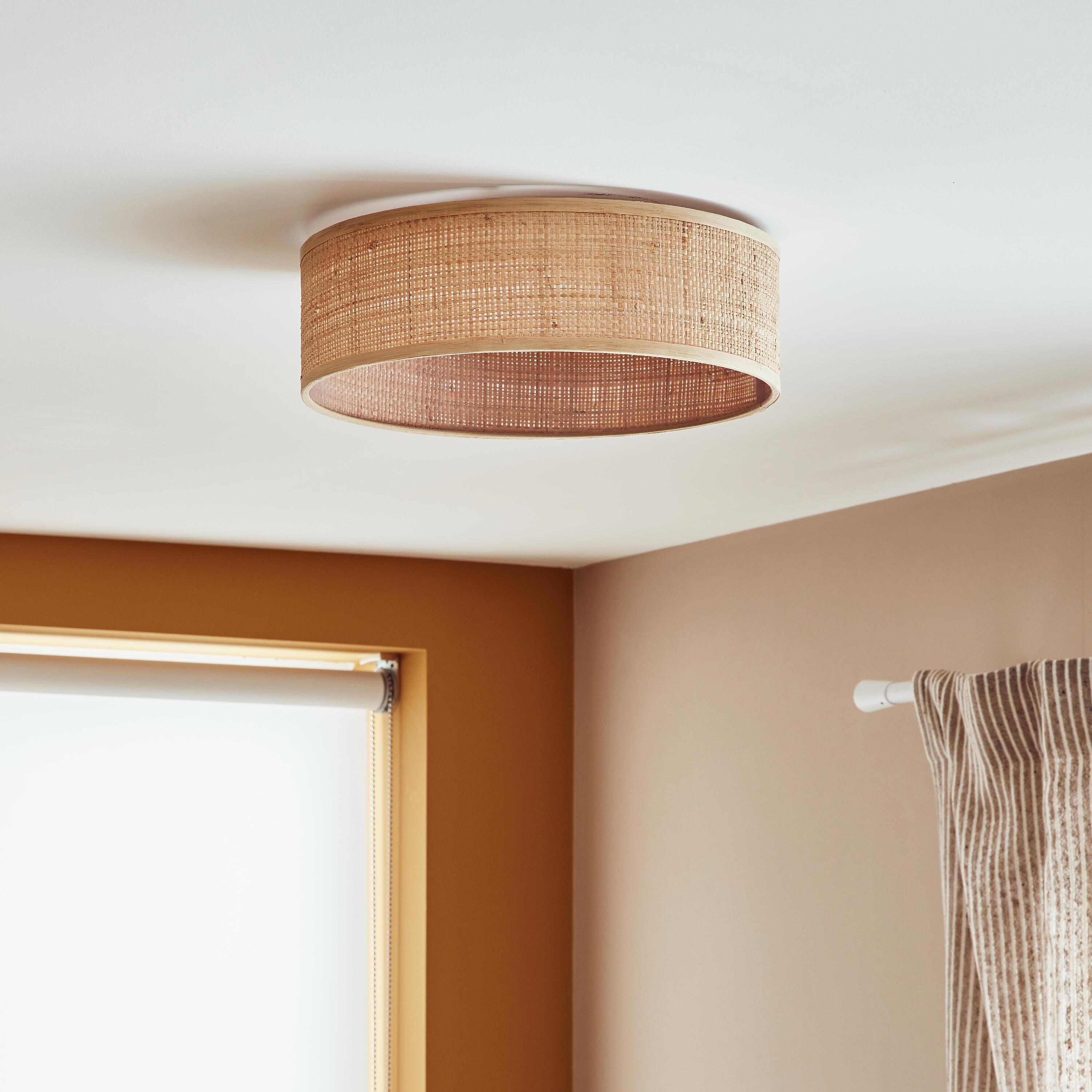 Woven natural fibre ceiling light in a contemporary residential interio
