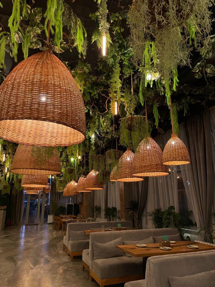 Woven rattan ceiling lights used in a warm boutique hospitality interior