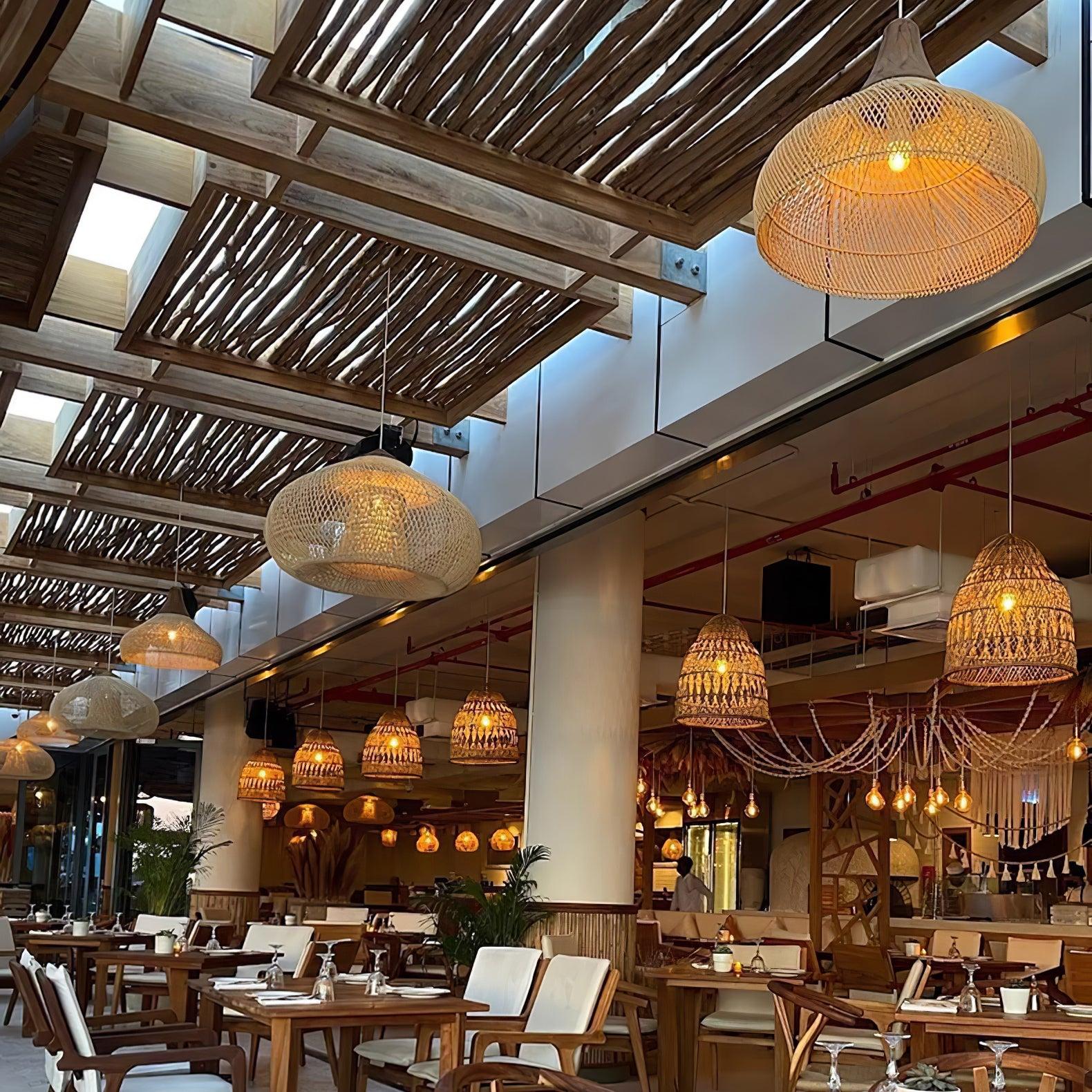 Woven rattan ceiling lights used in a warm boutique hospitality interior
