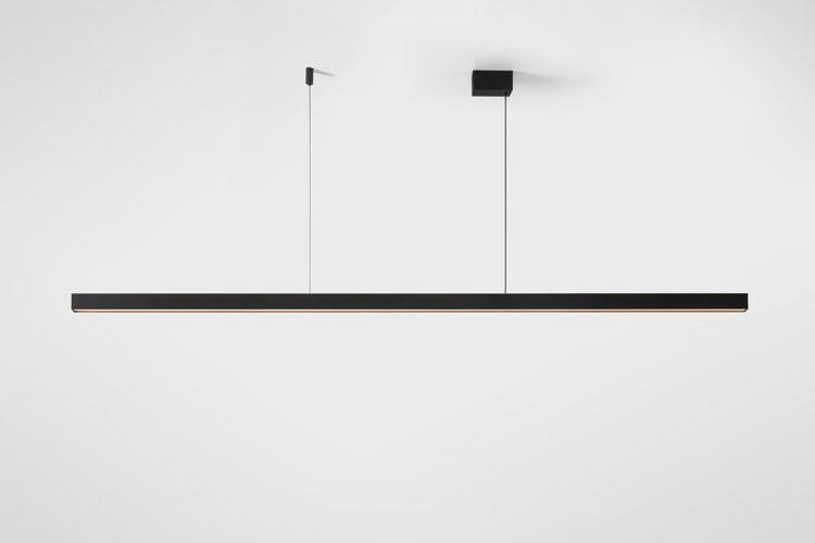 Front view of a contemporary linear pendant light for architectural interiors.