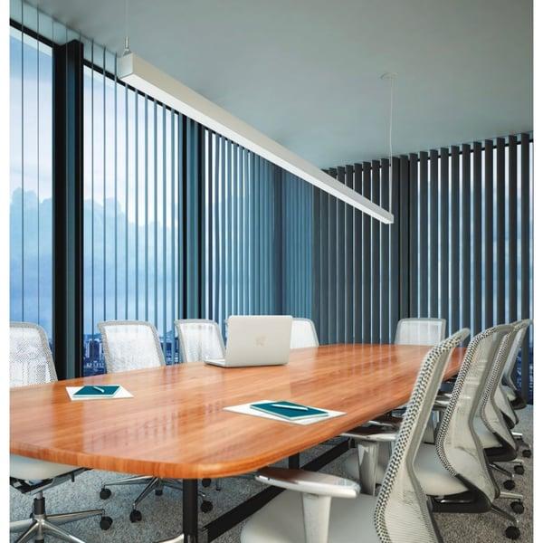 Linear pendant lighting installed in a modern office meeting room.