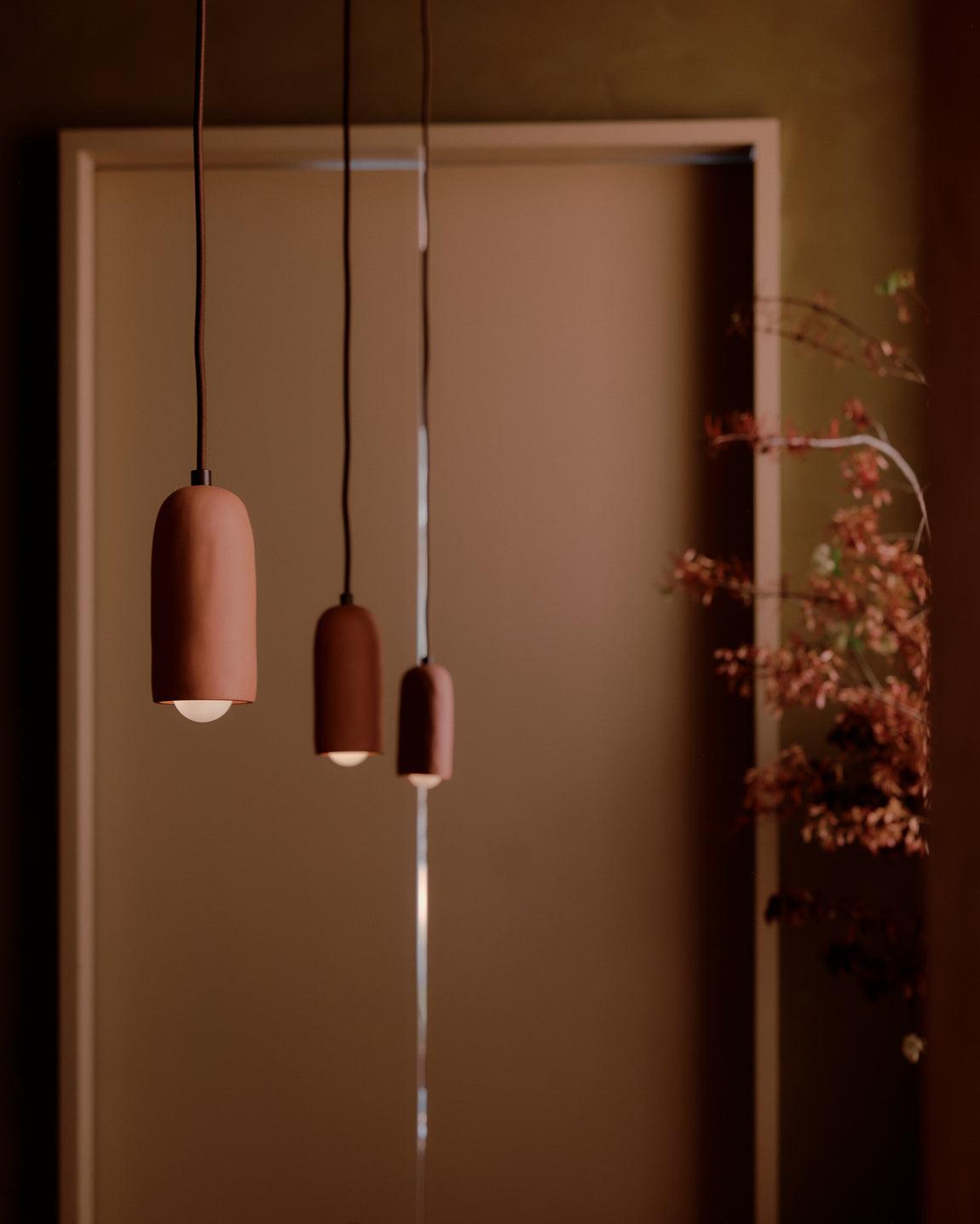 Ceramic pendant lighting installed in a contemporary residential interior.