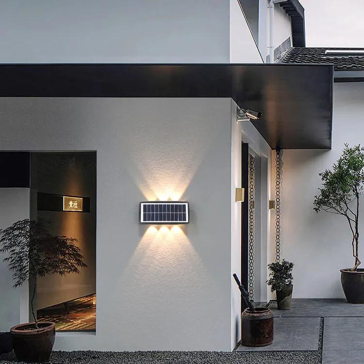 Solar LED wall lights installed on a contemporary residential façade.