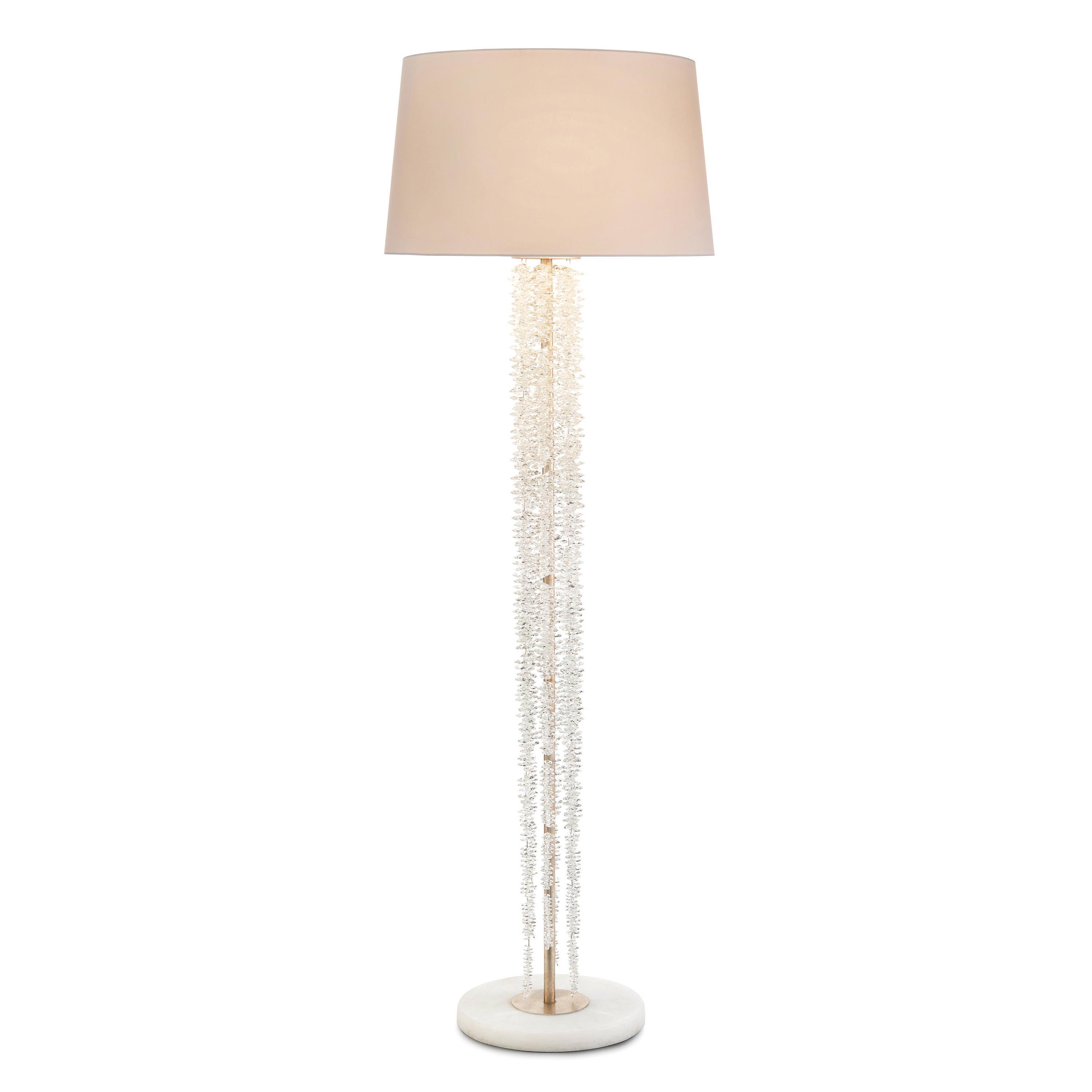 Crystal floor lamp photographed on a clean white background showcasing precision-cut crystal elements and premium metal finishes.