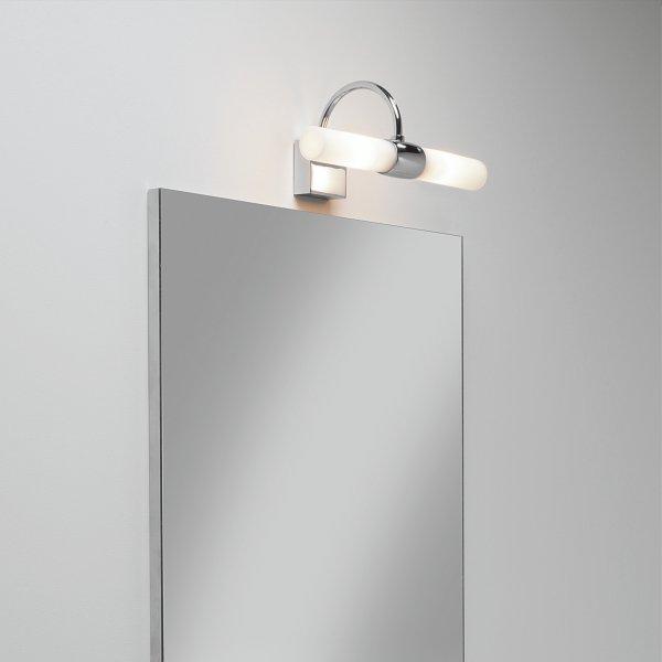 Mirror wall lamp installed beside a luxury hotel bathroom mirror providing balanced illumination.
