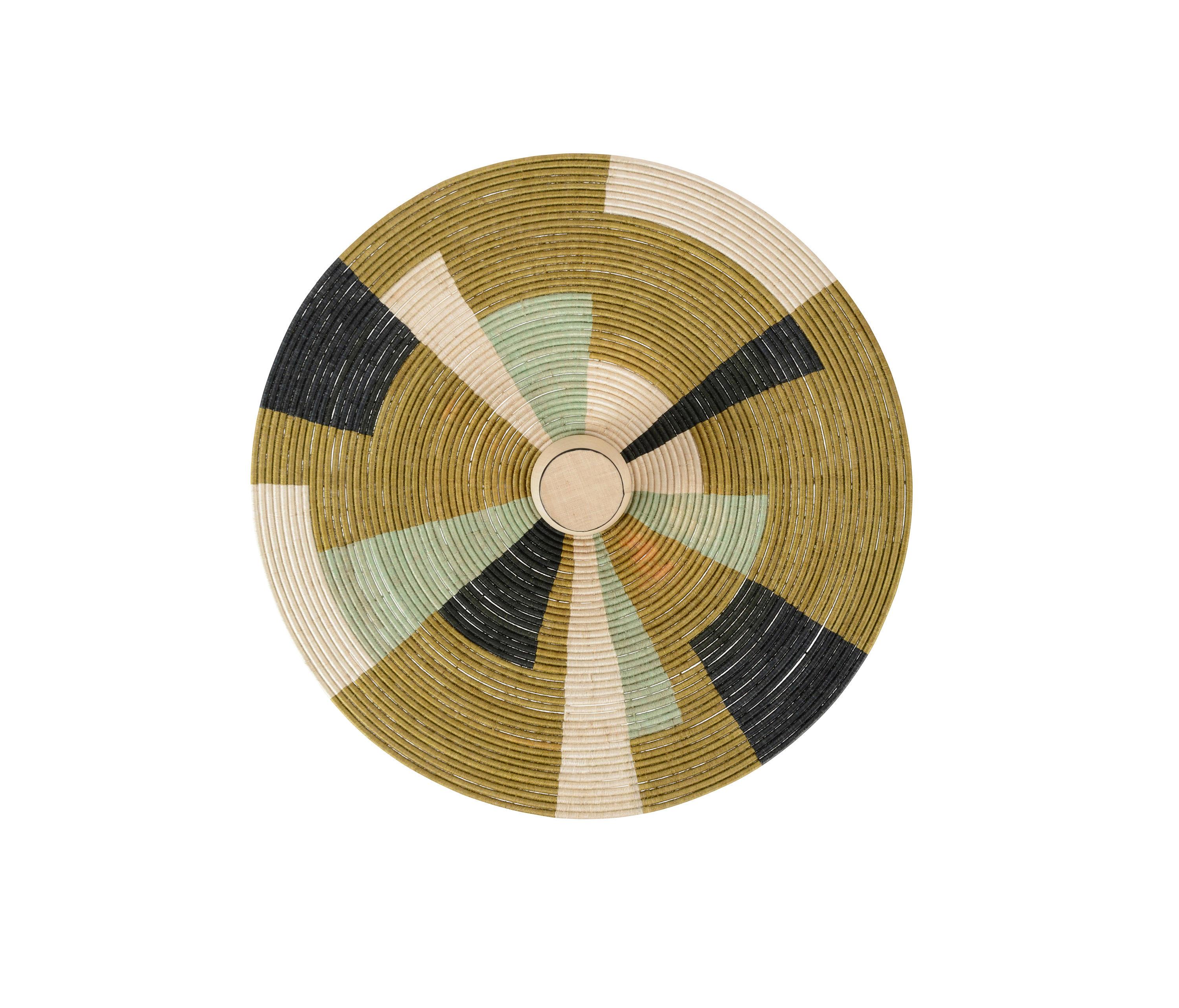 Handwoven rattan wall lamp photographed on a clean white studio background.